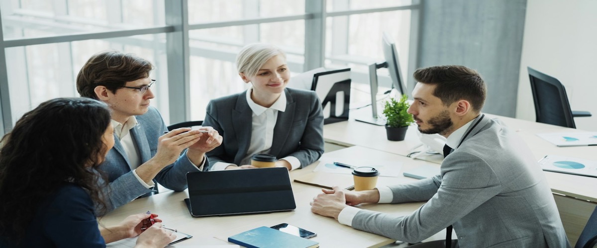 Small business team meeting with a marketing company in a modern office