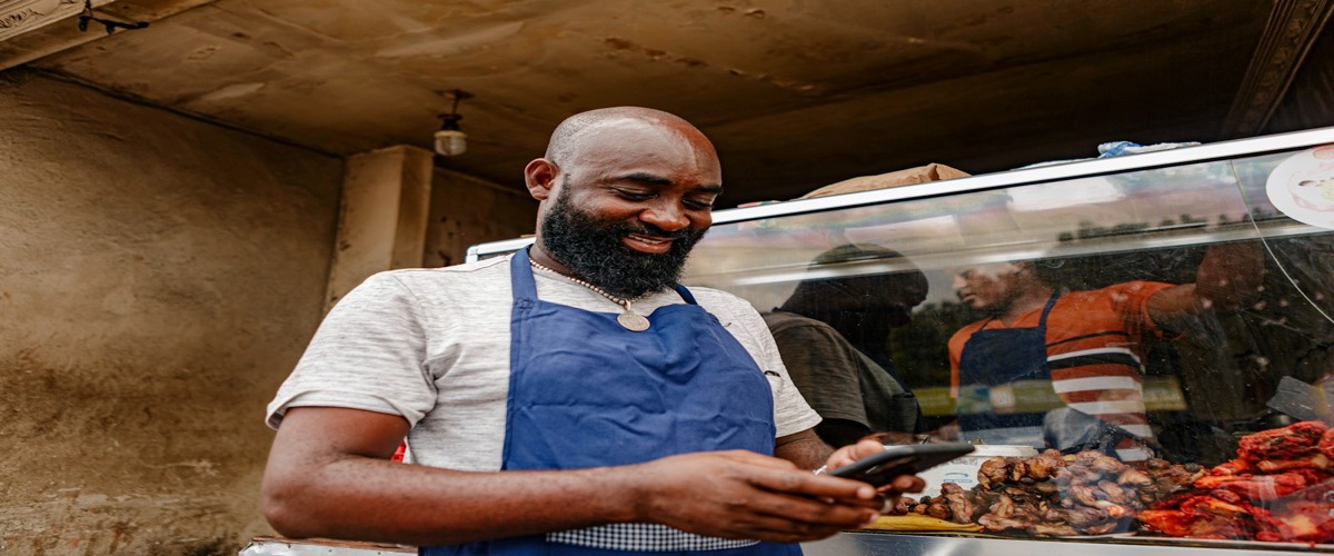 Small business owner checking their business listing on a smartphone